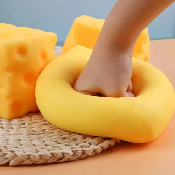 S4c3f60c7481c4d4ebe57ecf04fe69bf61.webp Giant Cheese Squishy Toy | Slow Rising Squeeze Fidget Toy UK
